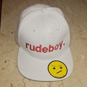White Cap with Red Embroidered 'rudeboy.' Logo